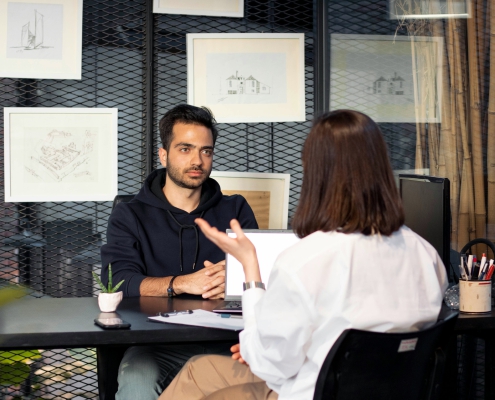 a man and a woman in an interview