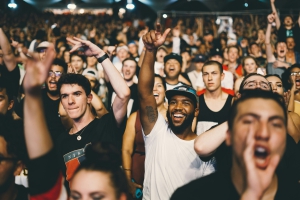 man in white shirt in a crowd