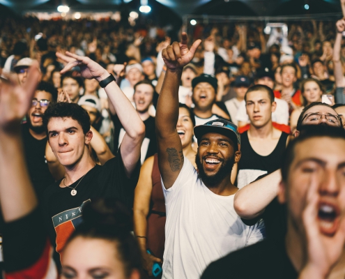 man in white shirt in a crowd