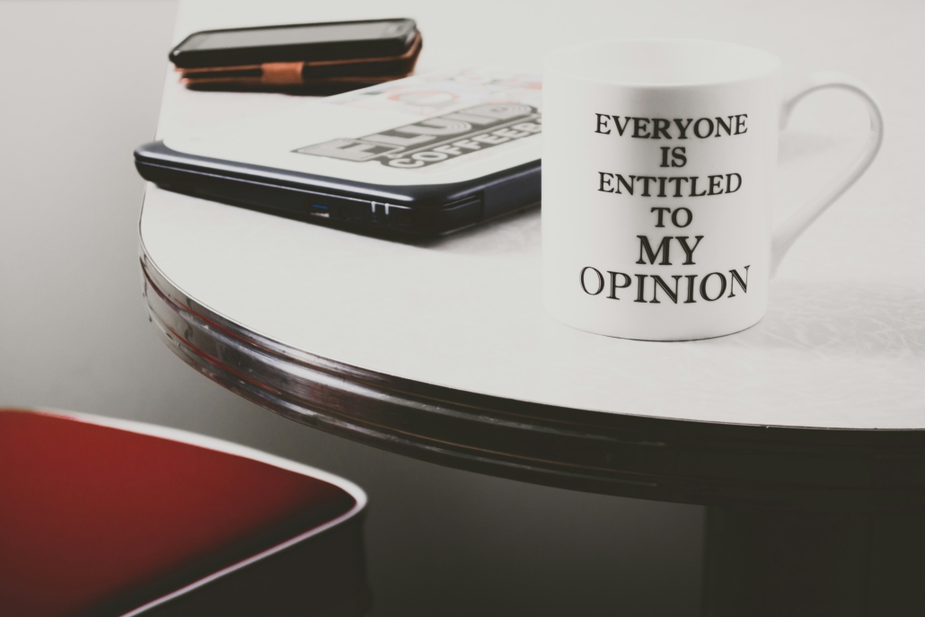 white cup on table